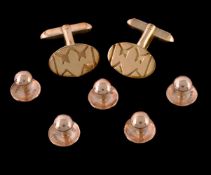 A pair of 18 carat gold cufflinks, the oval panels with t bar fittings, stamped 750 with full London