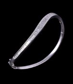 A diamond set hinged bangle, the curved bangle set with graduating baguette cut diamonds,