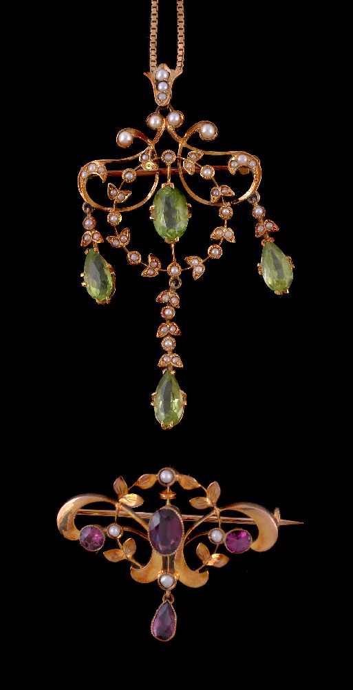 An Edwardian peridot and seed pearl pendant, the central marquise cut peridot within a scrolling