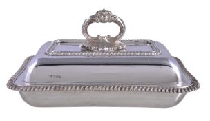 A late Victorian silver rounded rectangular entree dish, cover and handle by Harrison Brothers &