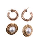 A pair of hooped earrings, the curved tubogas hoops, stamped with 9 carat gold import marks, with