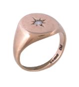 A 9 carat gold diamond signet ring, set with a brilliant cut diamond, estimated to weigh 0.08