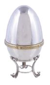 A silver parcel gilt surprise Easter egg by David Rhys Mills, London 1999 (millennium mark), opening