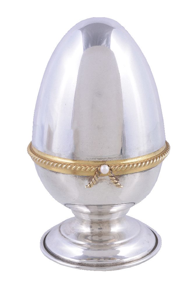 A silver parcel gilt surprise Easter egg by David Rhys Mills, London 1997, opening to reveal a