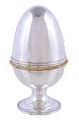 A silver parcel gilt surprise Easter egg by David Rhys Mills, London 2002 (jubilee mark), opening to