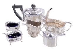 A small mixed collection of silver, comprising a matched oval half fluted three piece bachelor's tea