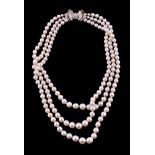 A three strand cultured pearl and diamond necklace, the three rows with graduating cultured