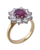 A ruby and diamond cluster ring, the oval cut ruby within a surround of brilliant cut diamonds,
