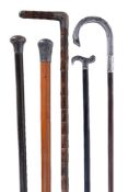 Five silver or silver coloured mounted walking sticks, one handle feigning a horse shoe, stamped