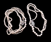 A two strand cultured pearl necklace, the graduated cultured pearls measuring 2.5mm to 6.9mm