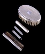 A silver brush and comb set by Harrison Brothers & Howson Ltd, Birmingham 1995, with engine turned