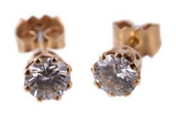 A pair of diamond ear studs, the brilliant cut diamonds estimated to weigh 0.70 carats total, in
