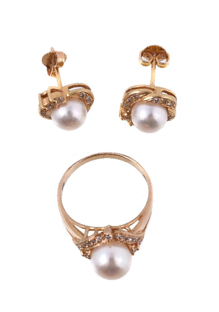 A pair of cultured pearl and diamond earrings and dress ring, the earrings each centred with a