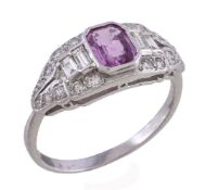 A pink sapphire and diamond ring, the tapering panel with a central step cut pink sapphire with