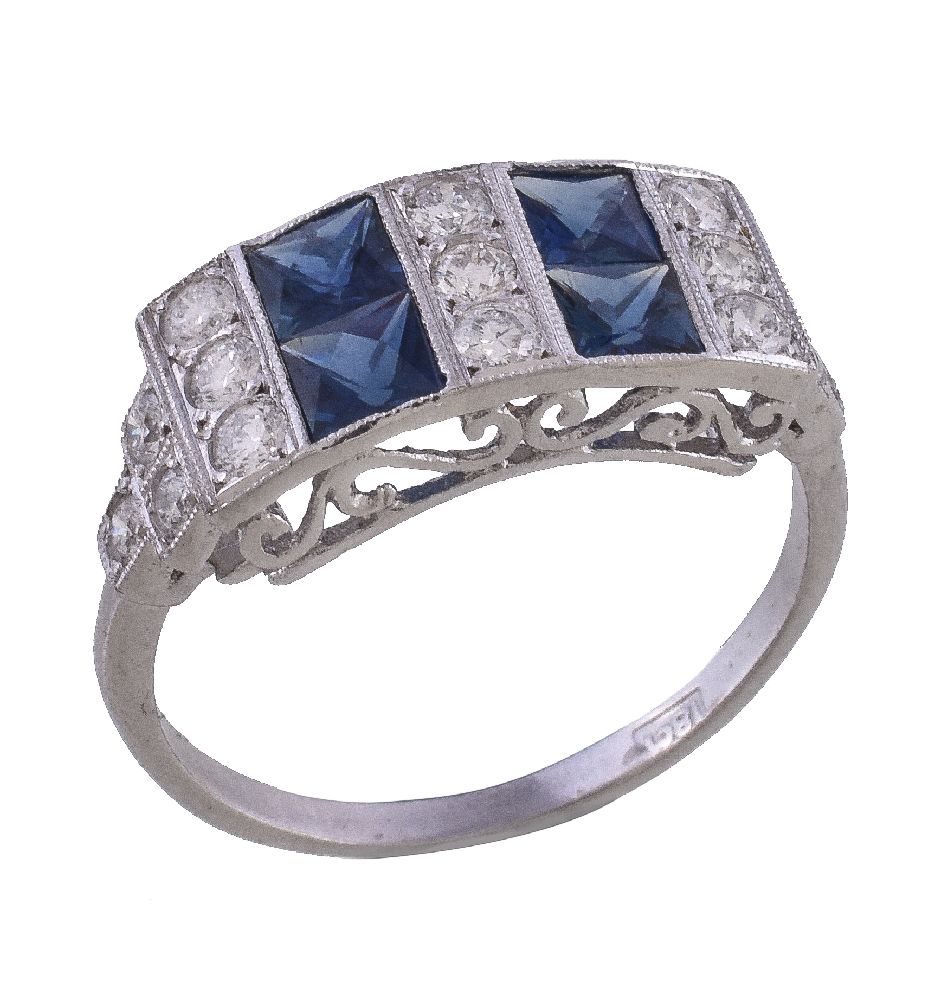 A diamond and sapphire panel ring, the rectangular panel with alternating rows of brilliant cut