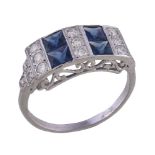 A diamond and sapphire panel ring, the rectangular panel with alternating rows of brilliant cut