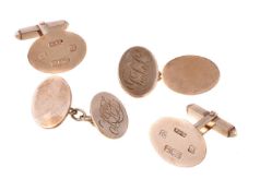 A pair of gold coloured cufflinks, the oval panels with t bar fittings, stamped 375 with full