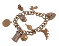 A 9 carat gold curb link charm bracelet, the curb link bracelet, with suspended charms, including