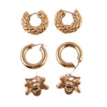 A pair of gold coloured flower head earrings, the textured flower heads stamped 750, 2.1cm wide;