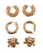 A pair of gold coloured flower head earrings, the textured flower heads stamped 750, 2.1cm wide;