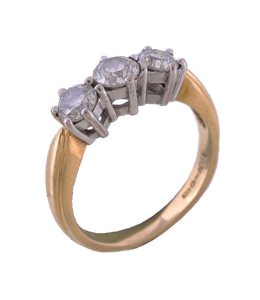 A diamond three stone ring, set with three brilliant cut diamonds, approximately 0.70 carats