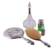 A collection of small silver, comprising: a silver collared cut glass tapered cologne bottle and