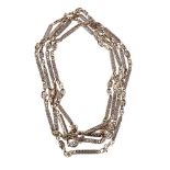 A fancy link long chain, with pierced oval and baton links, with a later added split ring clasp,