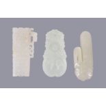 Three Chinese white jade archaistic carvings, the pale even stones with some mottled white