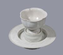 A Chinese Qingbai cup and stand, Southern Song Dynasty, the rounded cup with five-lobed rim the