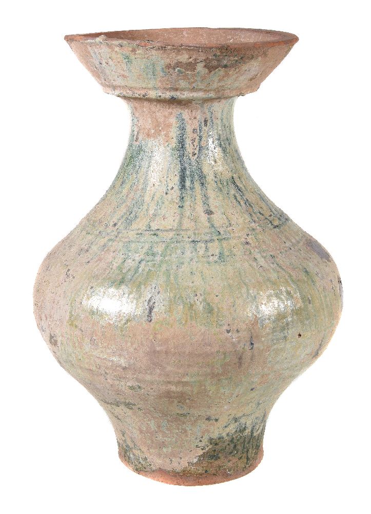 A Chinese green glazed pottery vase, hu, Han Dynasty (206BC-AD220), the baluster body incised with