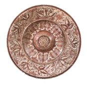 A Hispano-Moresque tin glazed pottery copper lustre charger, 16th century, with central boss and