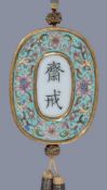 A Chinese Famille-Rose porcelain 'Floral' Abstinence plaque, Qing Dynasty, Qianlong Period, of