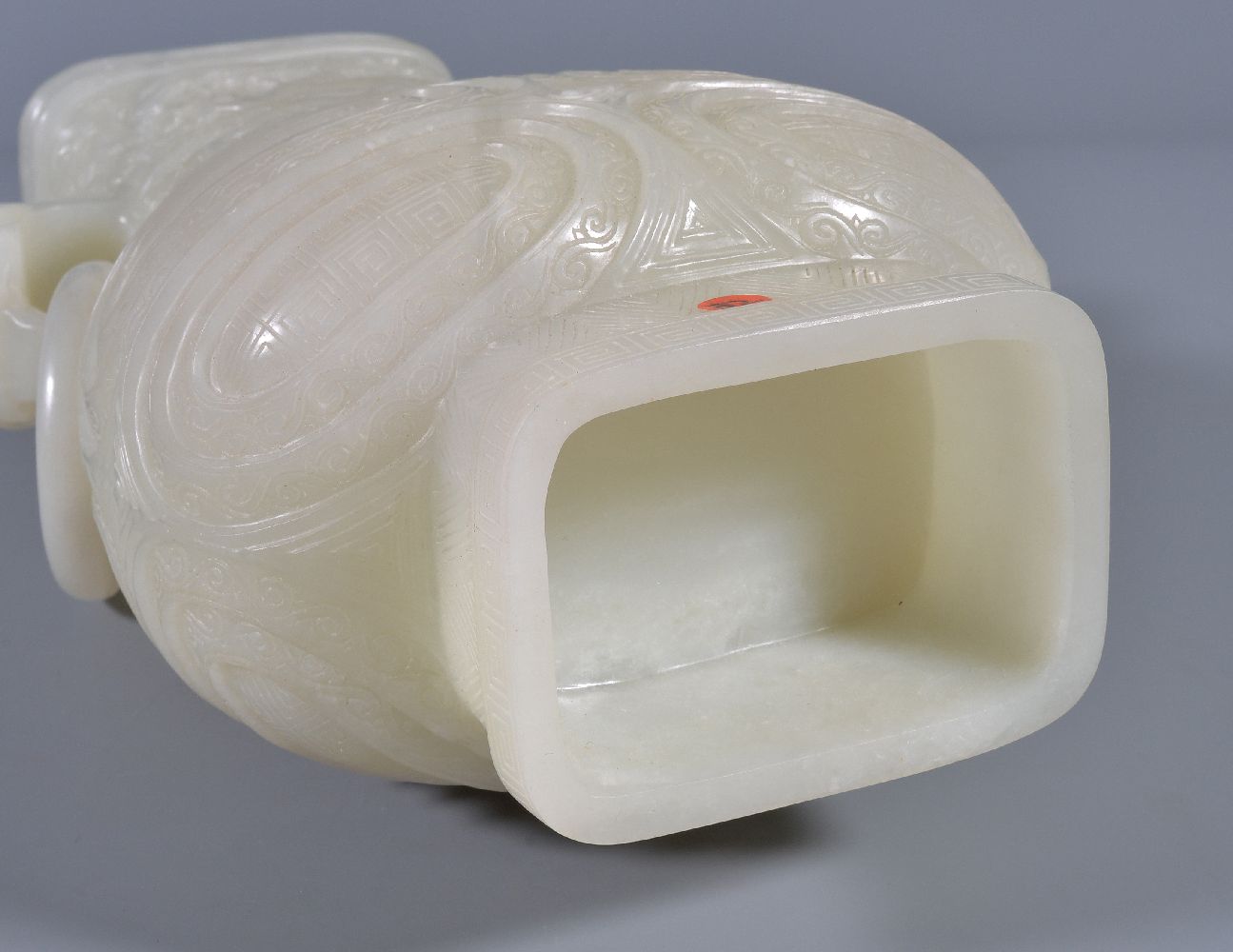 A Chinese white jade vase, hu, the pear-shaped vessel quartered on each side by high strapwork - Image 6 of 6