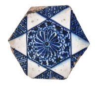 A Mamluk hexagonal blue and white tile, Damascus, first half of the 15th century, underglaze blue