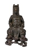 A small Chinese bronze of military official, seated, Ming or Qing Dynasty, on fitted pierced