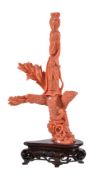 Y A Chinese coral 'Phoenix and Lady' carving, with a standing figure in long flowing robes