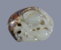 A Chinese white and russet jade 'melon and butterfly' pendant, with the russet and brown skin