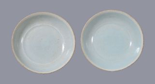 A small pair of Chinese Qingbai porcelain saucer dishes, Southern Song Dynasty, with pale celadon