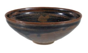 A Chinese 'Cizhou' russet-splashed bowl, Jin Dynasty, the robustly potted body with deep gently