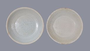 Two Chinese Qingbai moulded bowls, Southern Song Dynasty, the centres variously moulded with birds