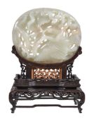 A Chinese white or pale celadon jade Yuan-style oval 'lotus and goose' plaque, carved in openwork