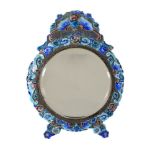 A Chinese enamelled metal mirror, late Qing Dynasty, with brightly coloured turquoise, blue and