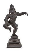 A small bronze dancing figure of Krishna, Southern India, 15-16th century, on double lotus base on