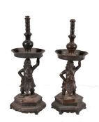 A pair of Chinese bronze figural taper or candlesticks, Ming Dynasty, 16 or 17th century, each