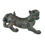 A Chinese archaistic model of a mythical tiger, the vigorously modelled striding beast with mouth