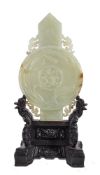 A Chinese Archaistic celadon and russet jade plaque, carved in the form of a gui sceptre