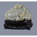 A Chinese celadon jade 'chilong and phoenix' boulder carving, Qing Dynasty, well carved, the front