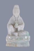 A Chinese Jadieite figure of Quanyin, seated holding a bottle, 13cm high 翡翠观音