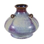 A Chinese flambé glazed vase, with a globular body, flared neck and lug handles, with apocryphal