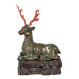 Y A Chinese bronze Warring States style stag, inlaid with scroll motifs coloured in gold and silver,